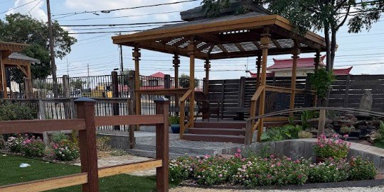 The arbor and planted beds in the garden