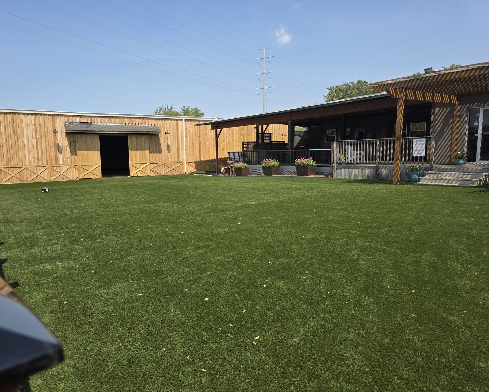 The turf yard at Midtown Ranchero, looking toward the barn and pergolas